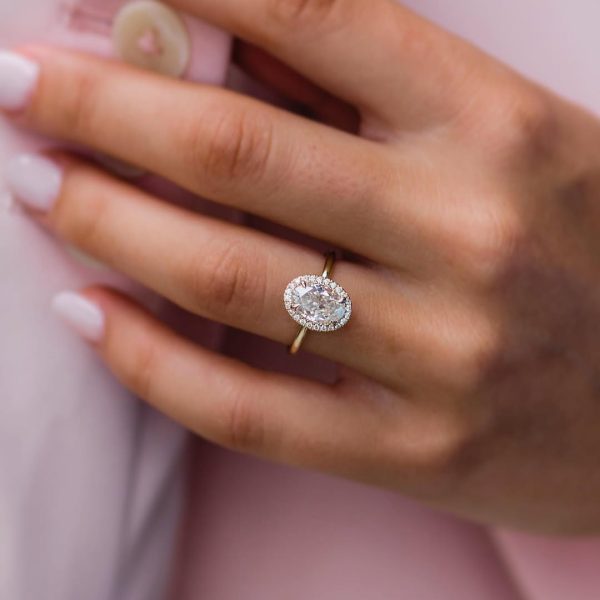 A dainty 1mm halo surrounding a 1.85 carat skinny oval with a solitaire band ✨