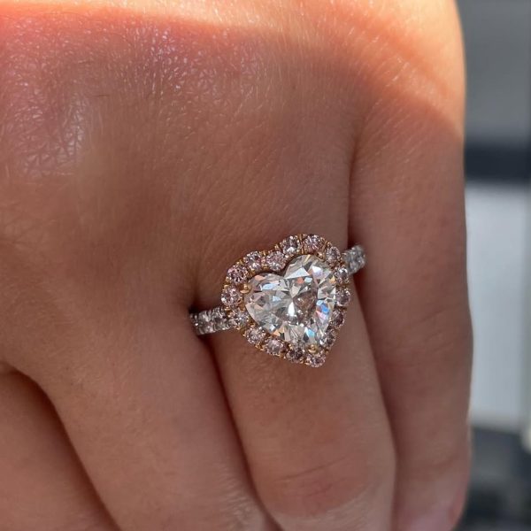 Capture her heart this holiday season with this heart shaped white diamond ring in pink diamond