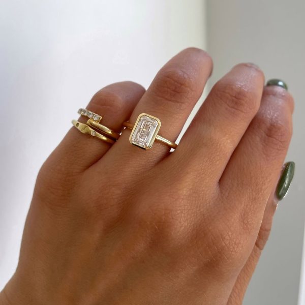 Ring stack inspiration for the gorgeous JOURNEE. An Emerald Bezel Solitaire paired with Cl