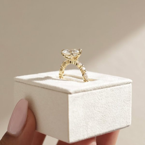 This pear doesn’t fall far from perfection. Beautifully accented with round and marquise stone (1)