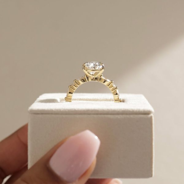 This pear doesn’t fall far from perfection. Beautifully accented with round and marquise stone (2)