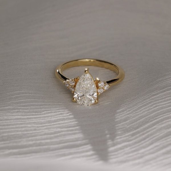 Timeless and effortlessly elegant Meet Brooke a stunning pear cut solitaire, accented with thr (1)