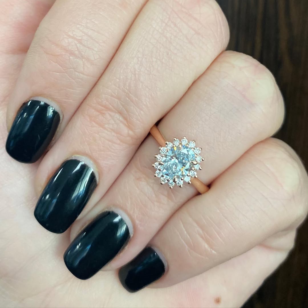 ✨The Elva! A 0.91ct oval diamond set within halo with added antique flare.Feel free to send us a